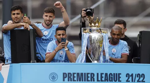 Manchester City players with the trophy (Reuters)